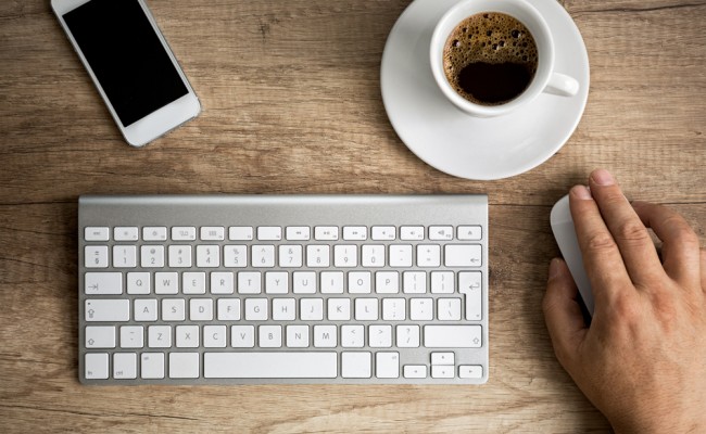 Male hand on computer mouse